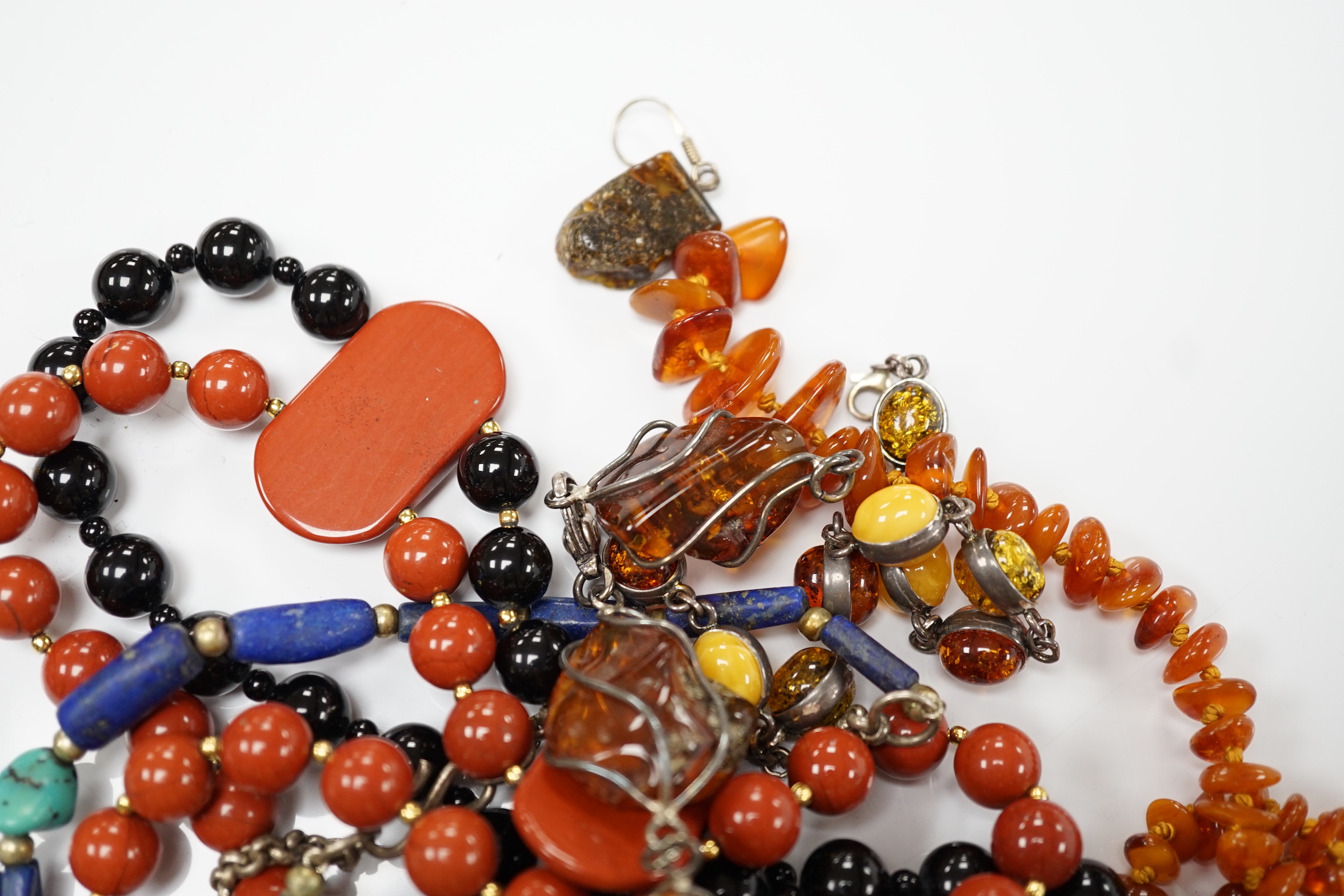 Kai Yin Lo- A twin strand black onyx and jasper bead necklace, 60cm and pair of matching drop earrings and a lapis lazuli and turquoise matrix necklace.